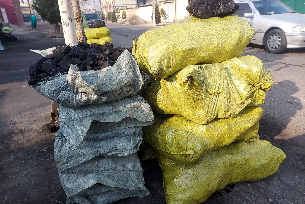 How much fuel is stored in Tajikistan to heat schools in winter