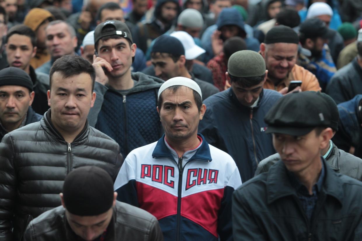 How many Tajik migrants are working in Russia?